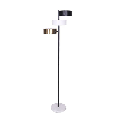 A Sarantino metal floor lamp with three cylinder shades in black, white, and gold finishes.