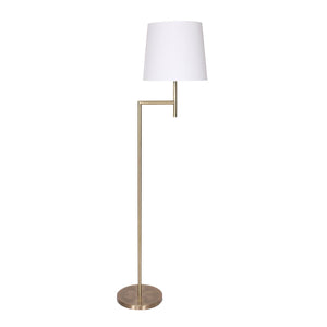 A modern floor lamp with an antique brass finish and a white tapered linen fabric shade.
