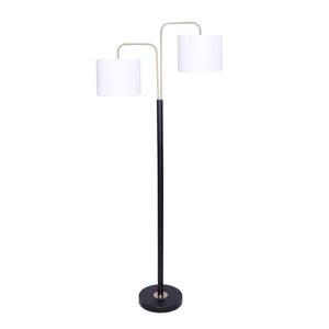 A floor lamp with a black base and brass finish accents, featuring two white linen shades.