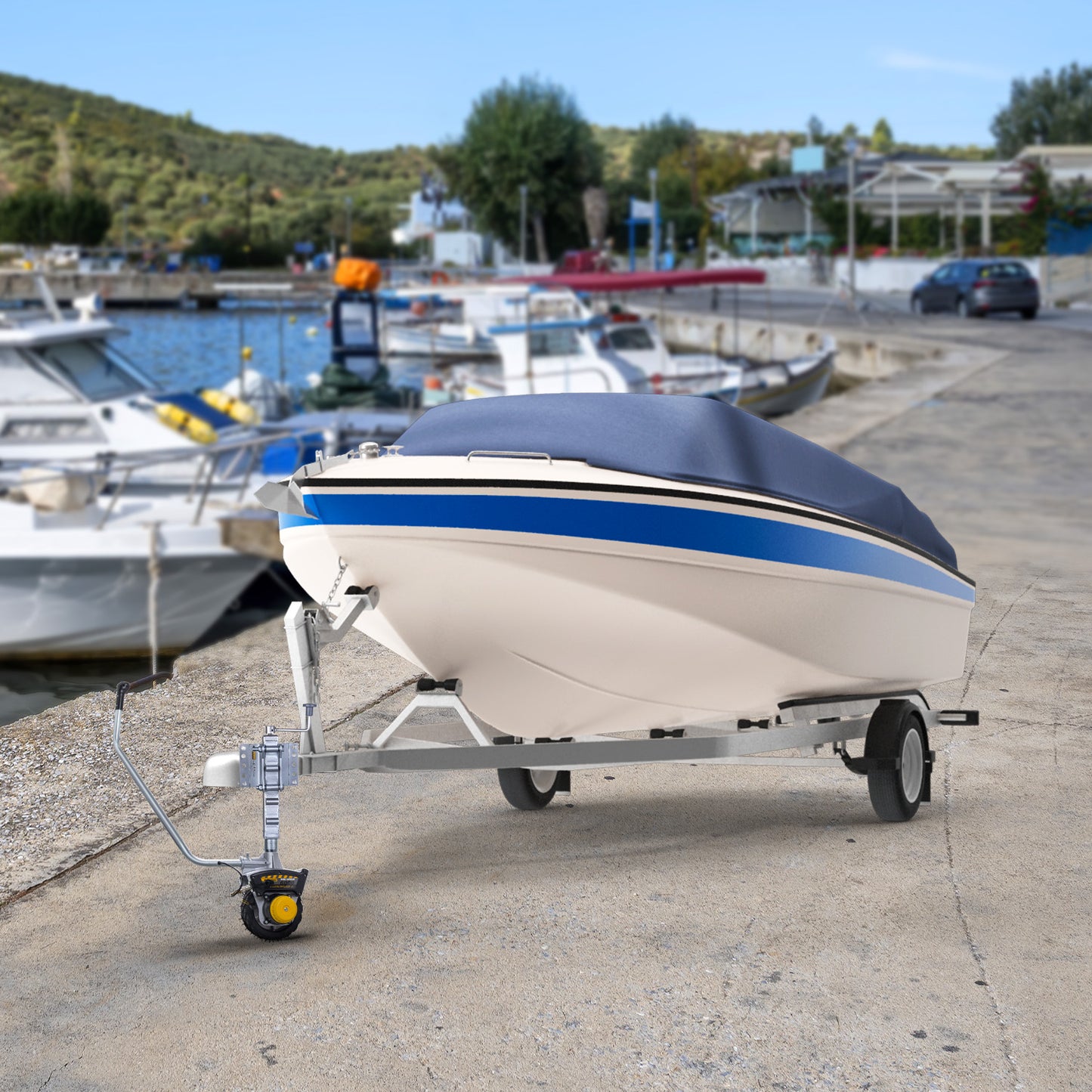 Small boat on a trailer at a marina with other boats and a scenic background.