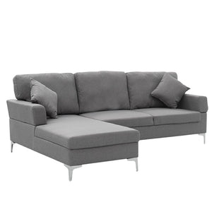 A dark grey Sarantino linen corner sofa with a right side chaise, featuring chrome-painted legs and high-density foam cushions.