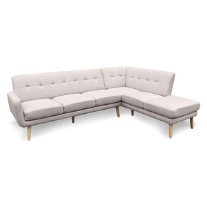 A light grey faux linen corner sofa with a chaise on the right side when viewed from the front. It has a wooden frame and legs and a tufted backrest.
