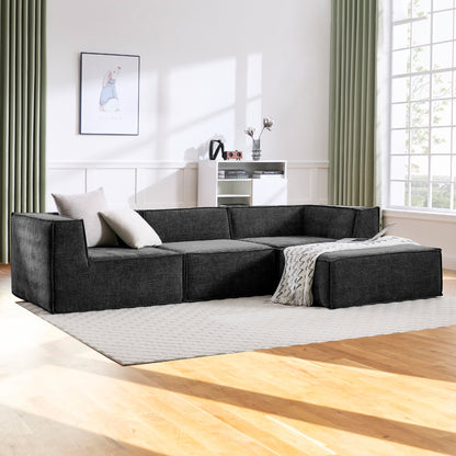 Gray sectional sofa in a modern living room with wooden floor and large window.