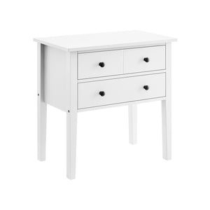 A white bedside table with high-leg design and three drawers, each with a round black handle.