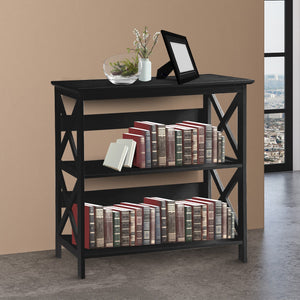 Black bookshelf with books and decorative items against a beige wall.