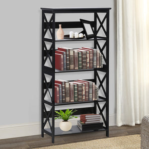 Black bookshelf with books and decor items against a neutral wall.