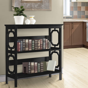 Black bookshelf with decorative items in a room with a kitchen in the background