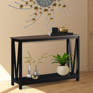 Console table with decorative items against a beige wall