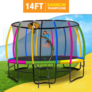 14ft rainbow trampoline with a child jumping, on grass with a blue sky background.