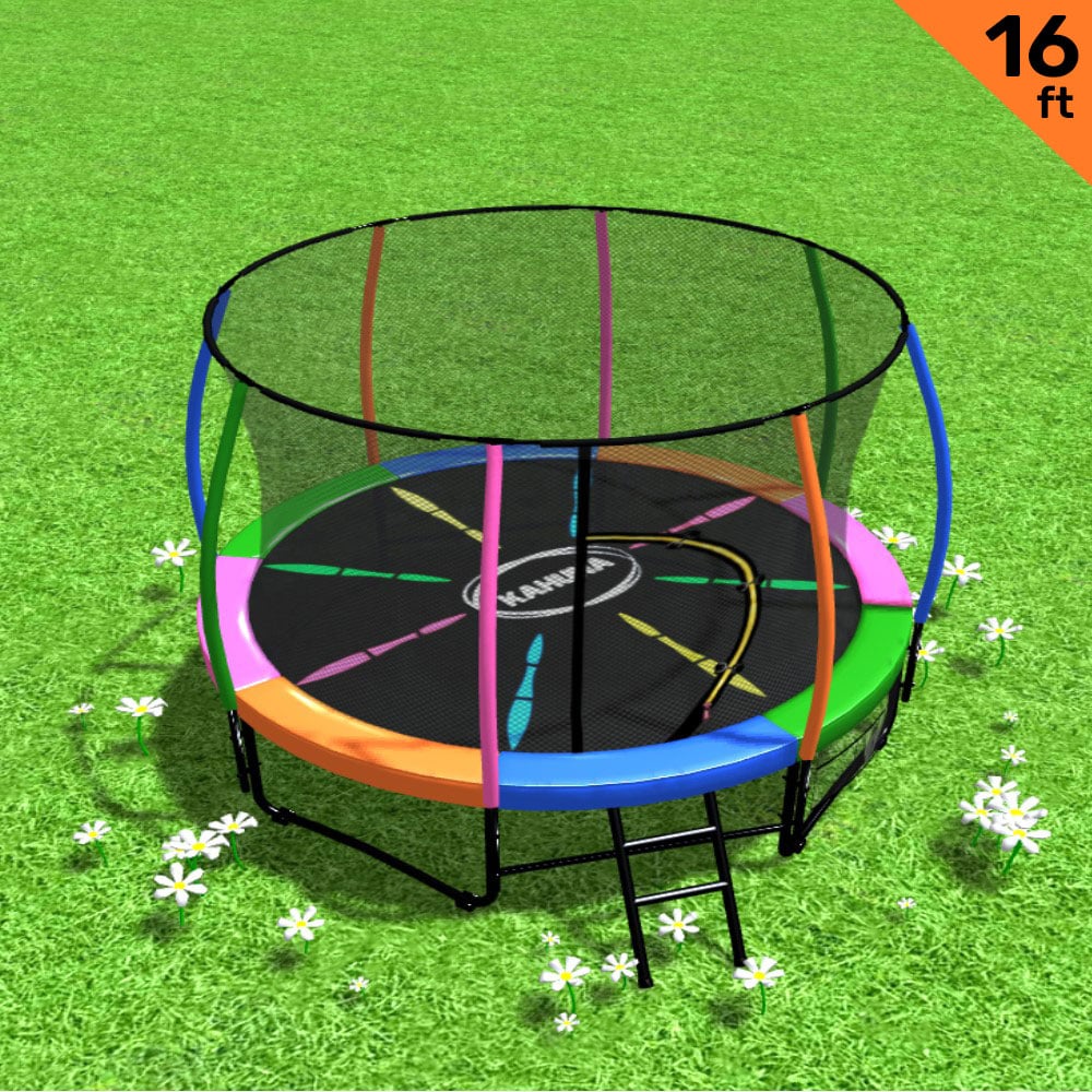 A 16ft round Kahuna trampoline with a safety enclosure net and a ladder, set on a grassy surface with a multicolored padding cover.