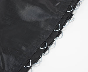 Close-up of a black trampoline mat showing the texture and the edge with metal loops and stitching.