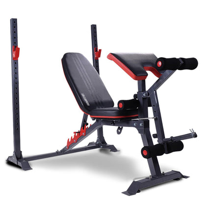 Adjustable weight bench with red and black padding, gray steel frame, and includes leg development attachment and preacher curl pad.