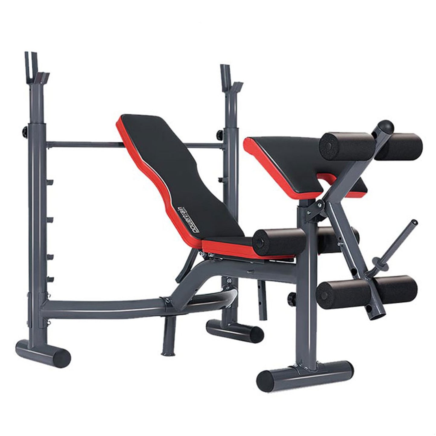 Adjustable weight bench with red and black padding, including an Olympic bar, preacher curl attachment, and leg curl extension.