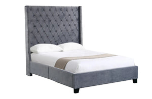 Gray upholstered bed with tufted headboard on a white background