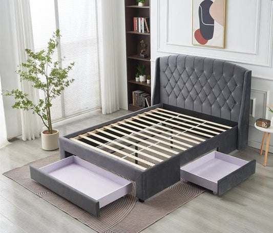 Gray upholstered bed with storage drawers in a bedroom setting.