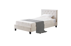 Beige upholstered bed with white mattress and gray checkered blanket on a white background