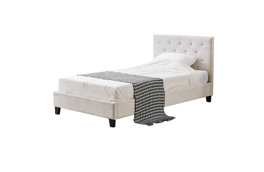 Beige upholstered bed with white mattress and gray checkered blanket on a white background