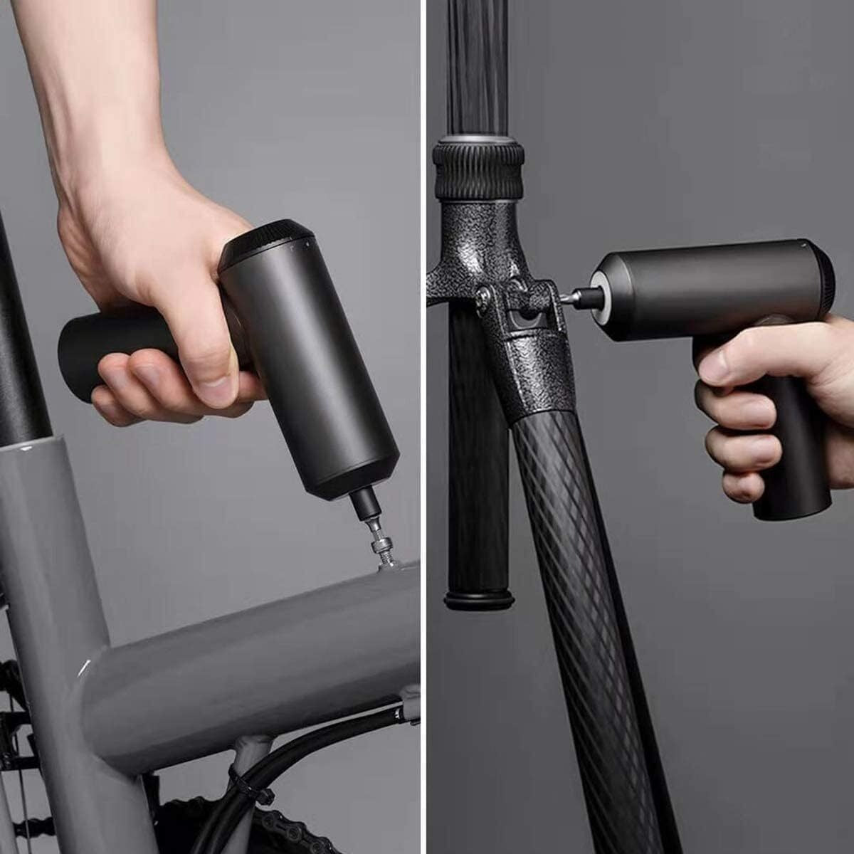 Hand using a bicycle pump to inflate a bike tire on a gray background