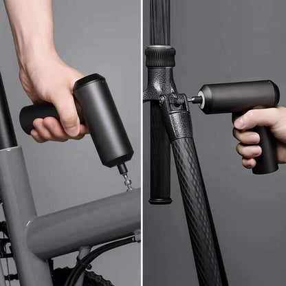 Hand using a bicycle pump to inflate a bike tire on a gray background
