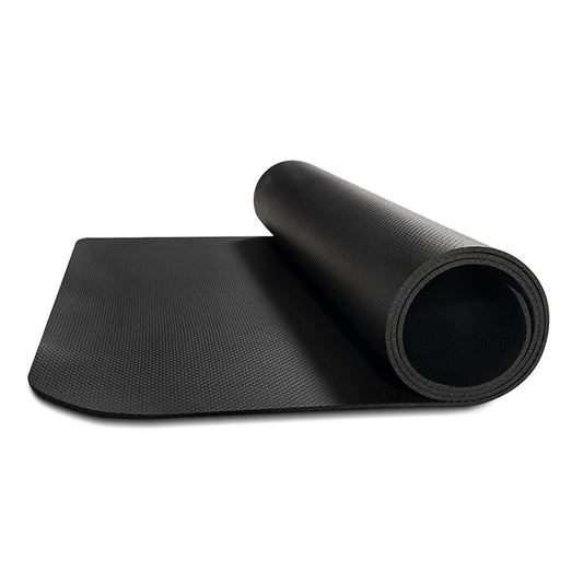 Black yoga mat rolled up on a white background