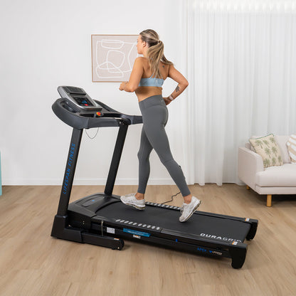 Woman using a treadmill in a home setting