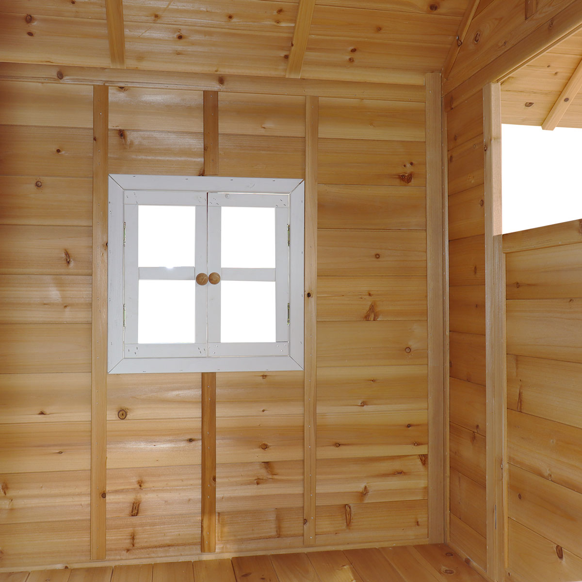 Wooden cabin interior with a small window
