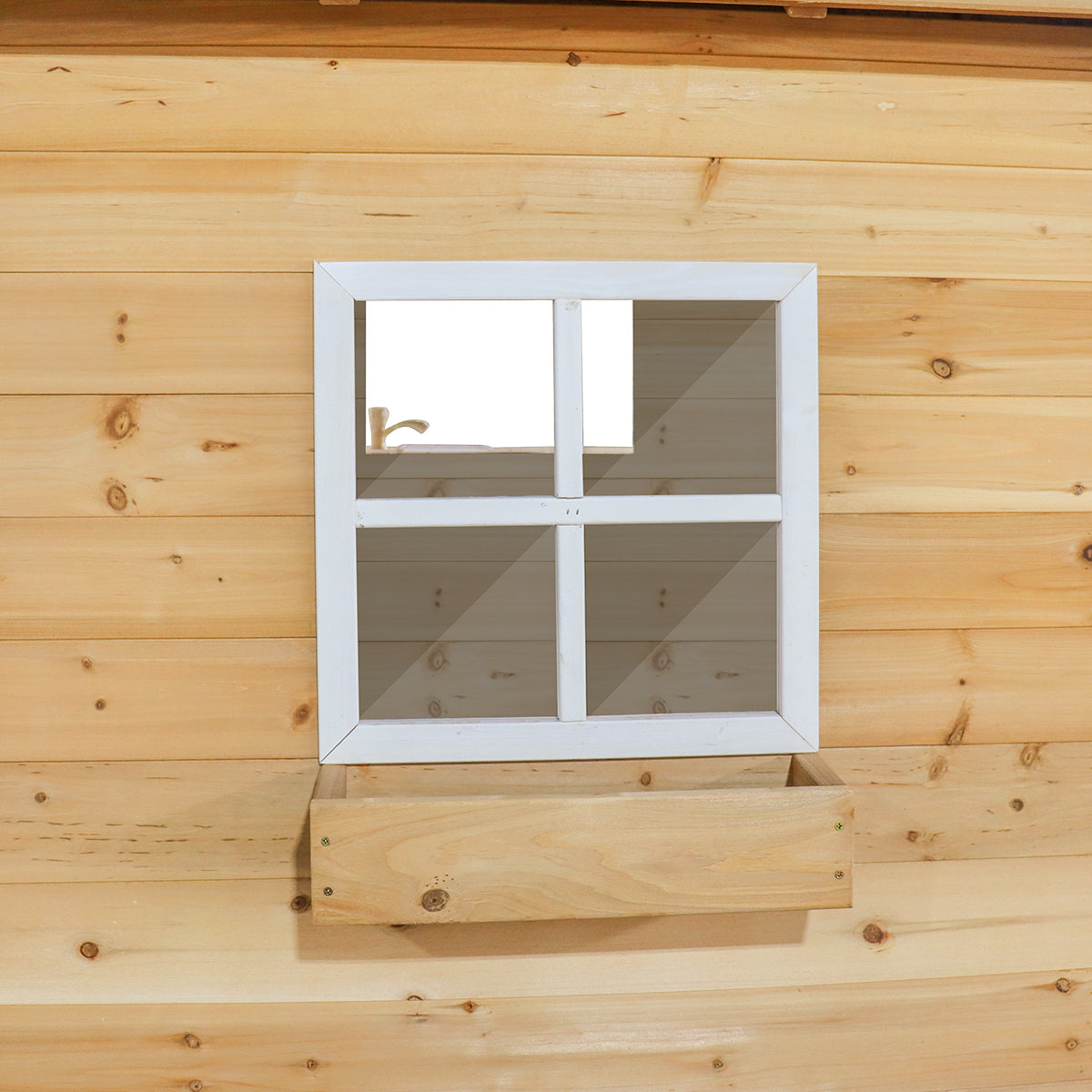 Wooden wall with a white window frame