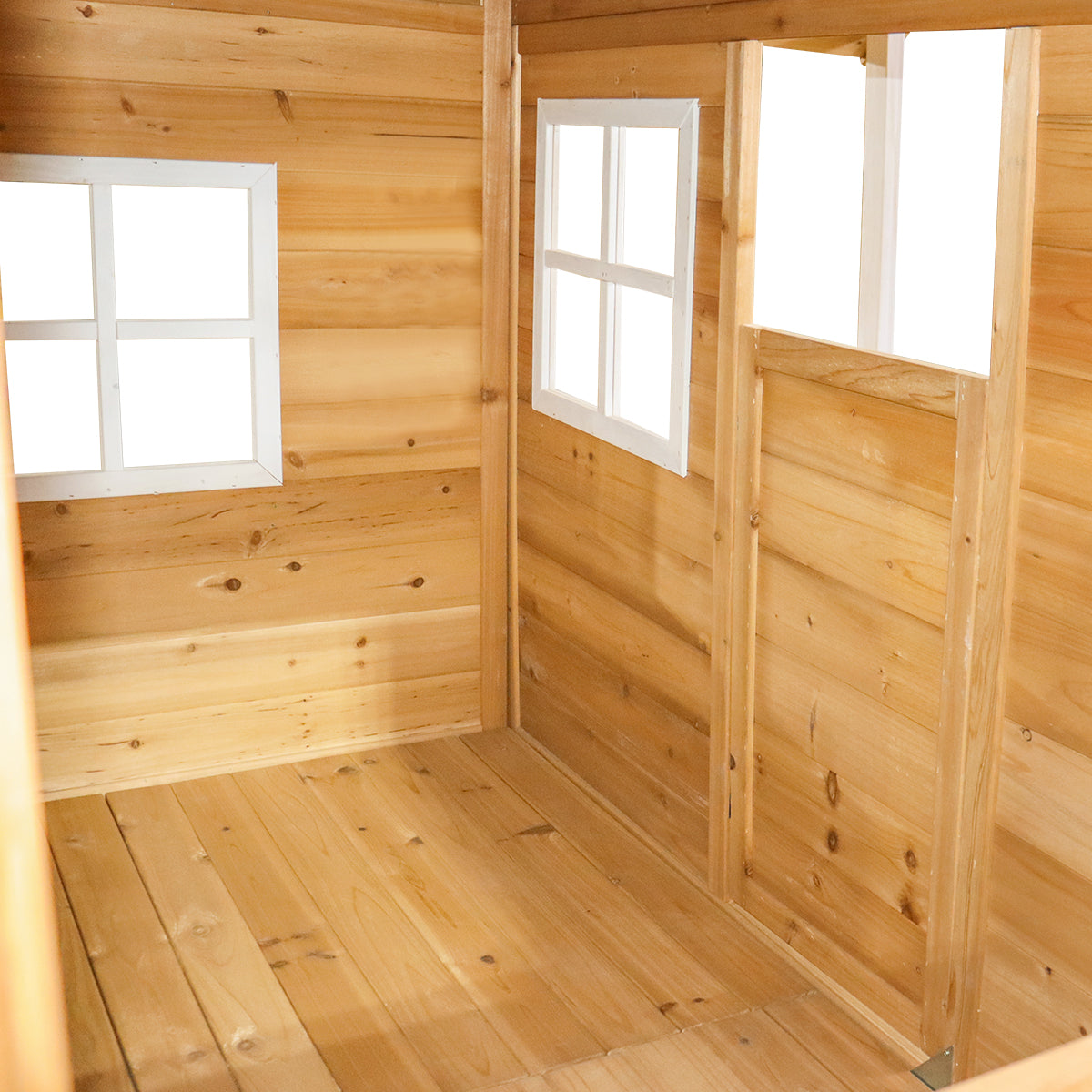 Wooden interior of a shed with windows