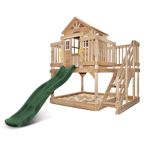 Wooden playhouse with a green slide on a white background