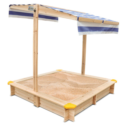 Wooden sandbox with a striped canopy on a white background