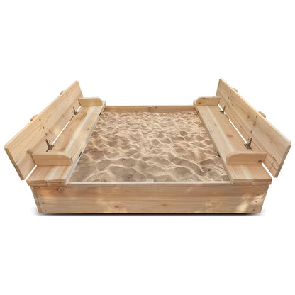 Wooden sandbox with sand on a white background
