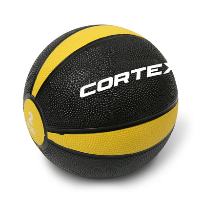 A black and yellow color-coded Cortex brand medicine ball with a rubber casing.