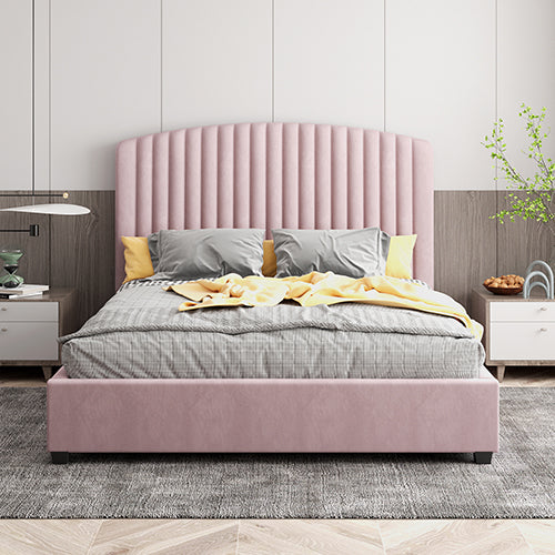 Pink upholstered bed with gray bedding in a modern bedroom setting.