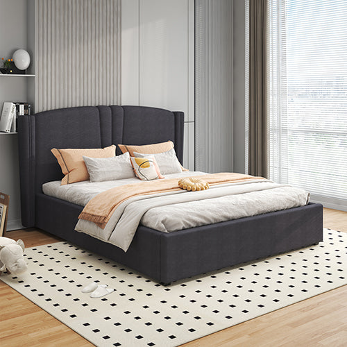 Gray upholstered bed with bedding in a modern bedroom setting
