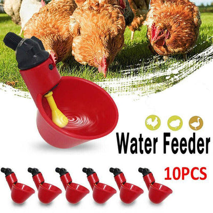 Red water feeder with yellow spout for chickens on a white background