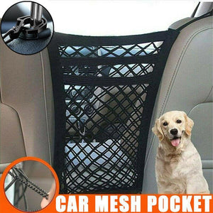 Car mesh pocket attached to a car seat with a dog sitting next to it.