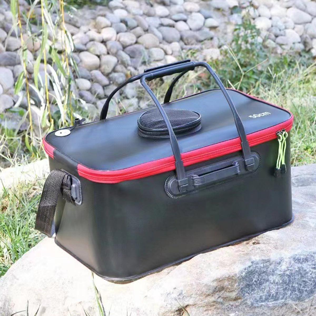 Black and red Live Bait Bucket on a rock with a natural background