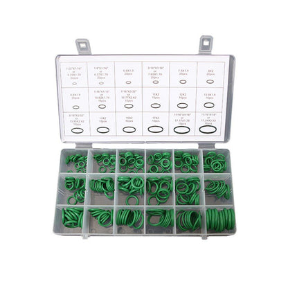 Set of green washers in a clear plastic case with measurement chart on a white background