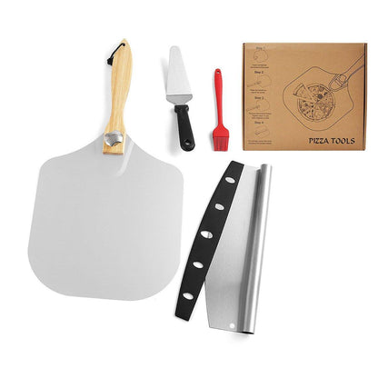 Set of pizza tools including a peel, spatula, brush, and a box labeled 'Pizza Tools' on a white background.