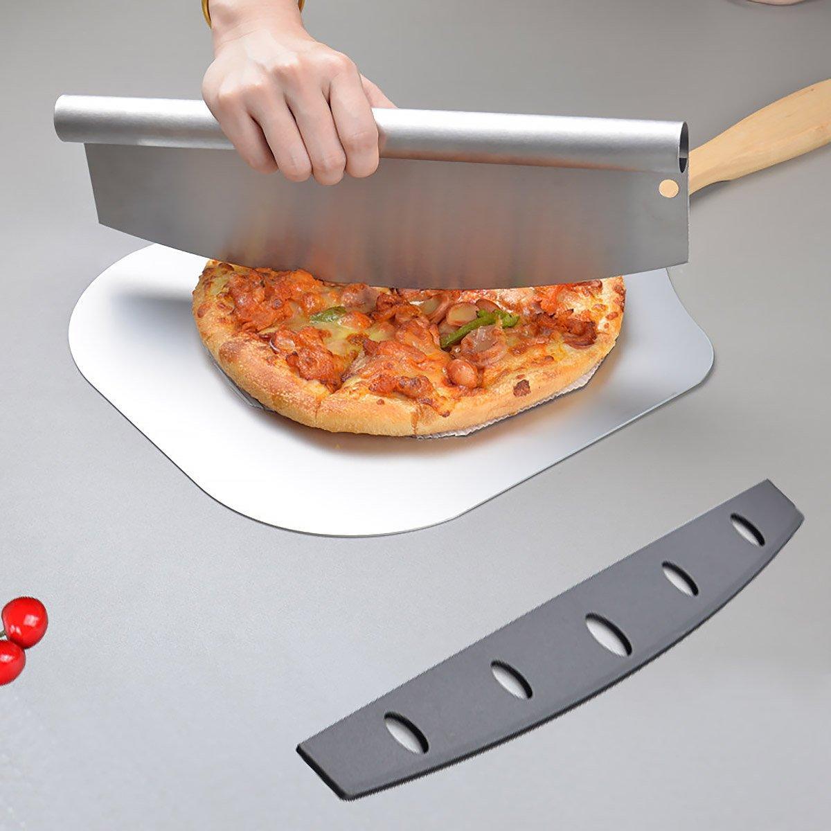 Person using a pizza peel to lift a pizza from a stone on a gray surface.