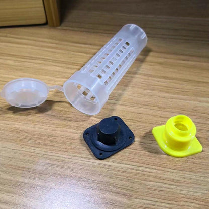 Plastic container with a lid and two additional components on a wooden surface