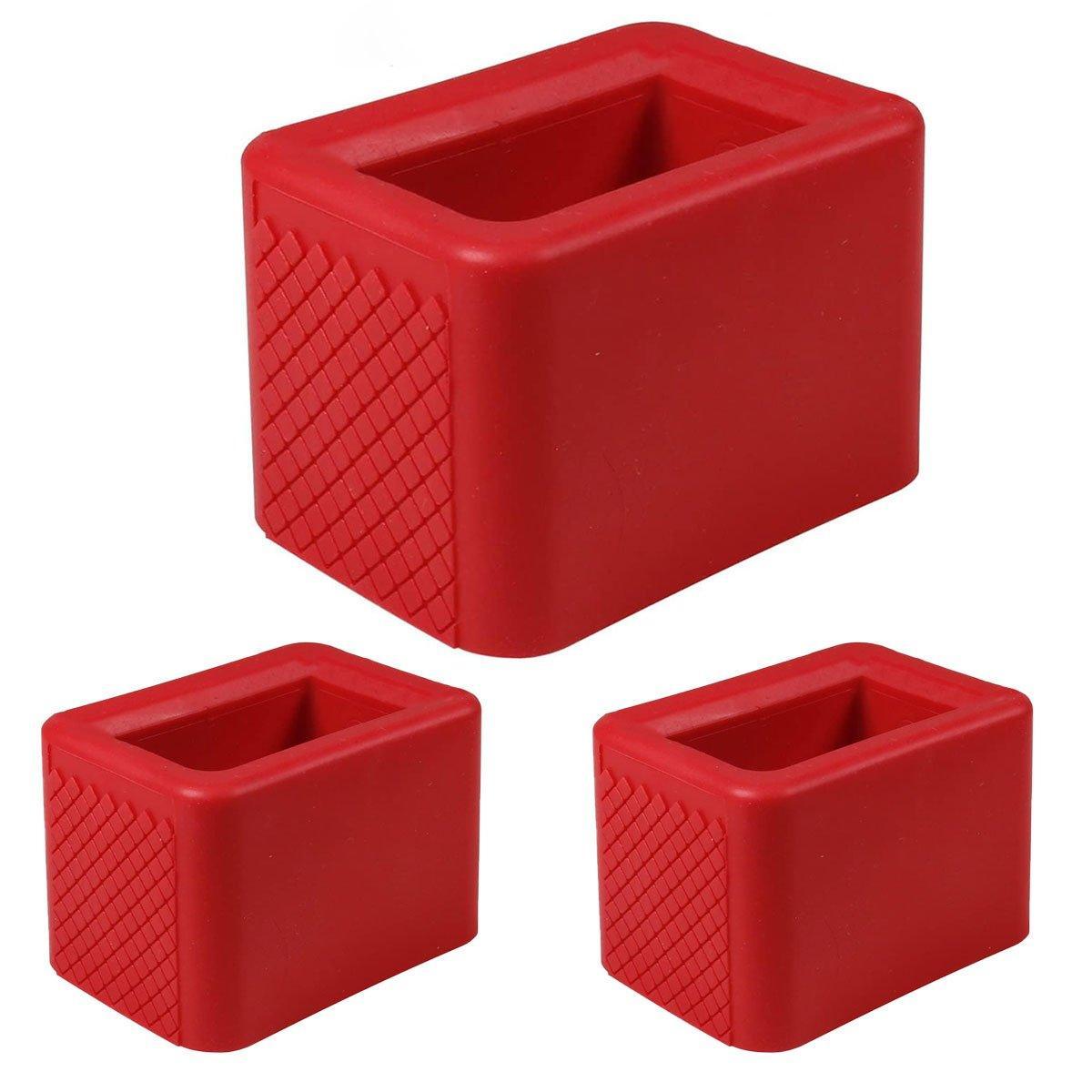 Three red rectangular blocks with textured surface on a white background