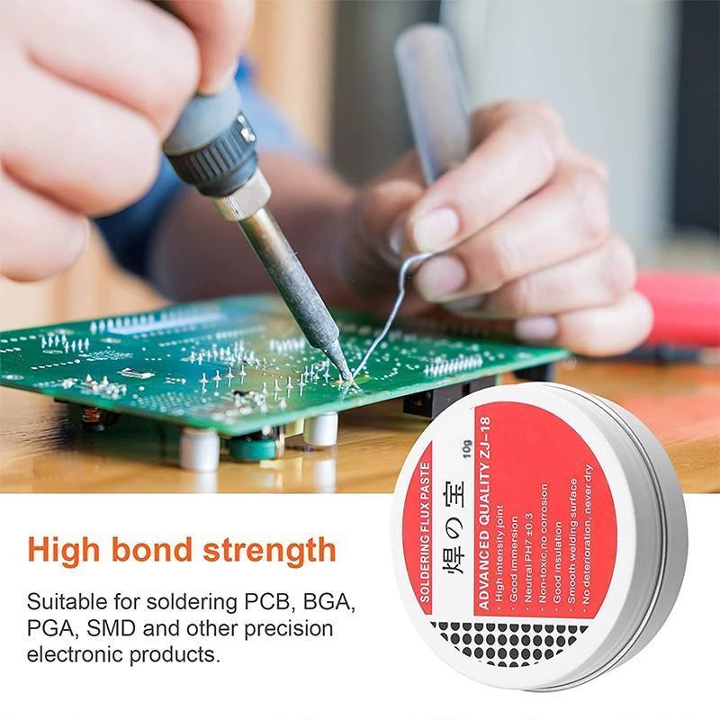 Person soldering a circuit board with a tin of soldering flux paste labeled 'High bond strength'.