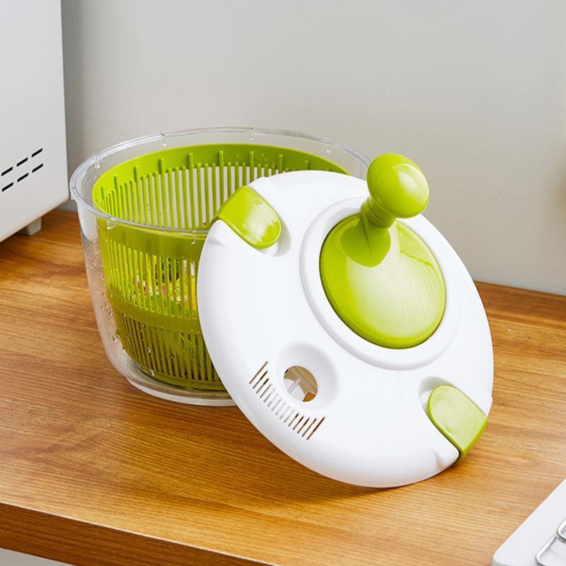 Green and white kitchen tool on a wooden surface