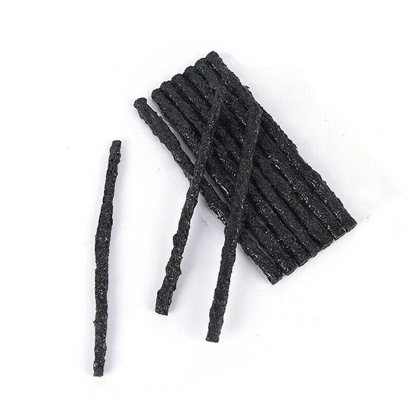 Black Tyre Repair Plugs on a white background