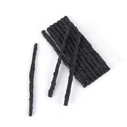 Black Tyre Repair Plugs on a white background