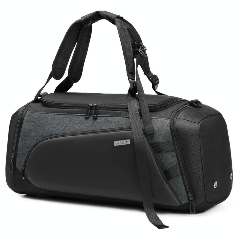 A large grey gym bag with separate compartments for wet and dry items, featuring multiple zippers and a thick handle.