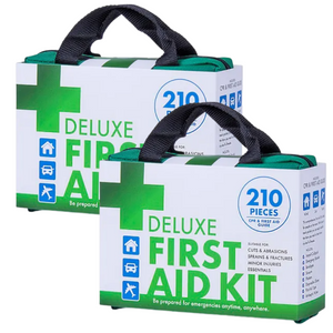 Two deluxe first aid kits with green and white packaging, labeled 210PCS and indicating they are suitable for emergencies.
