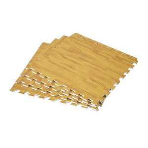 A set of beige interlocking EVA foam floor mats arranged on a surface, resembling a wooden texture.