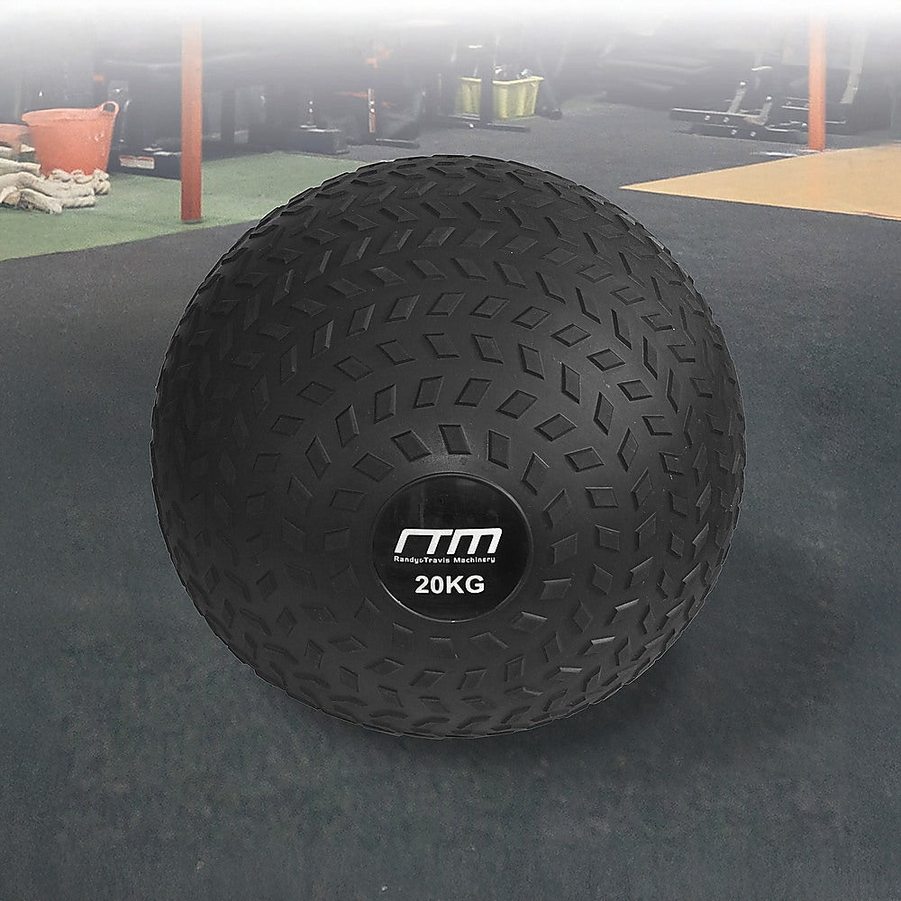 Black exercise ball with '20KG' marking on a gym floor